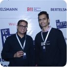 Two men standing together at an event